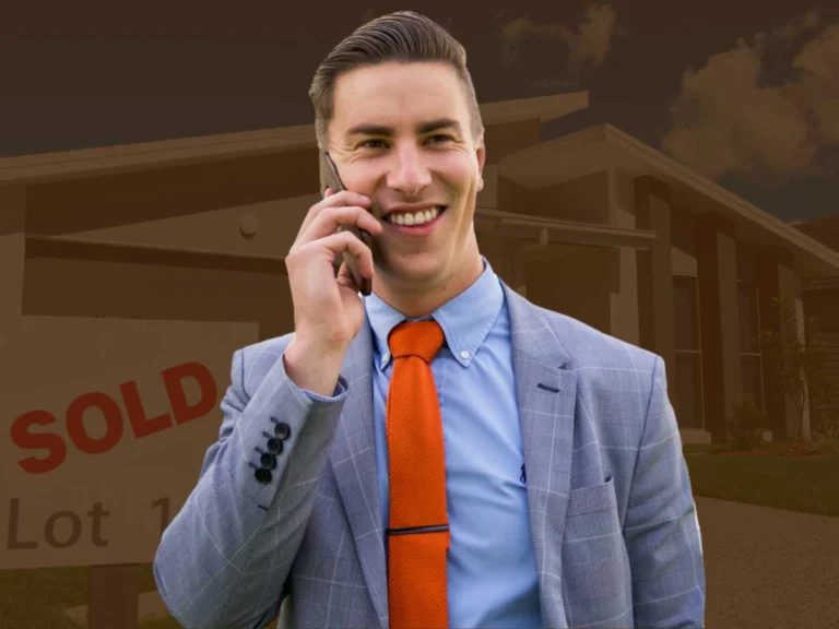 Trent standing in front of a house sold sign after getting somebody their first home loan