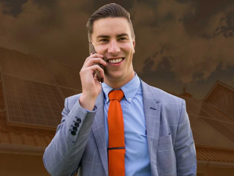 Trent standing in front of solar panels discussing green home loans