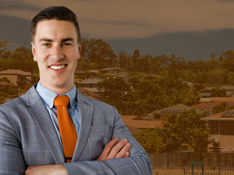 A Perth mortgage broker against a backdrop of Australian houses.